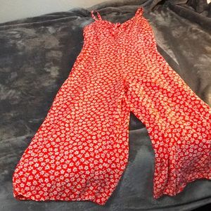 A red pant suit with flowers